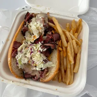 My Jawbreaker takeout with fries and pickle slice.