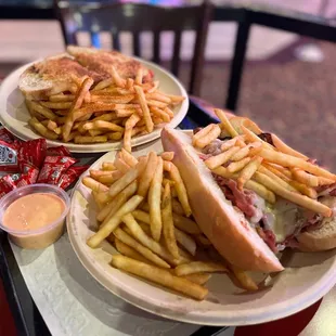a plate of french fries and a sandwich