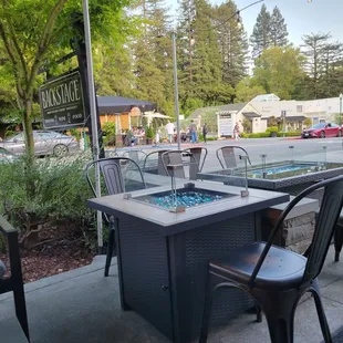 a patio with a table and chairs
