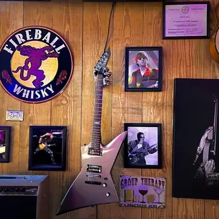 a guitar, amp, and other memorabilia