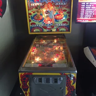 a pinball machine with lights on