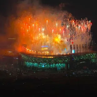 fireworks exploding from the top of a building
