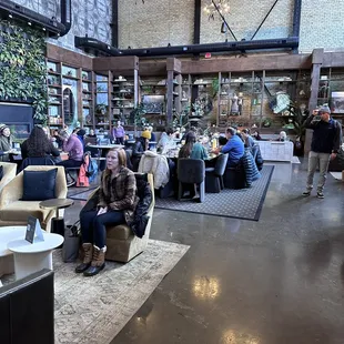 a group of people sitting at tables