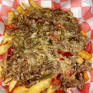 a cheeseburger fries in a basket