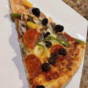 Thin crispy base with nice seasoning and fresh ingredients - tasty and more than we could eat in one session. Good the next day