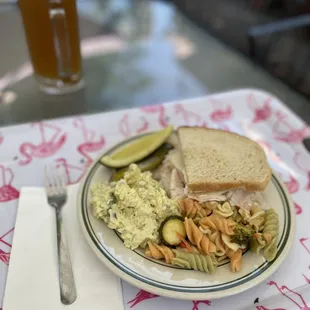 Half Turkey Sandwich with a side of potato salad - pickles and pasta salad from the side bar and a cold blue moon draft beer