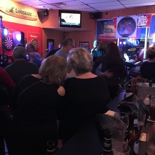 a group of people at a bar