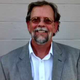 a man with glasses and a beard