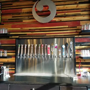 a row of beer taps
