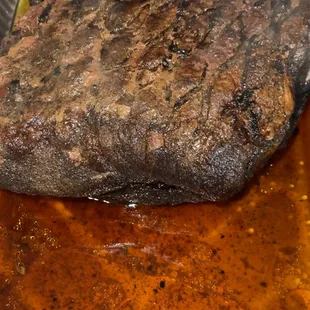 a steak in a foil pan