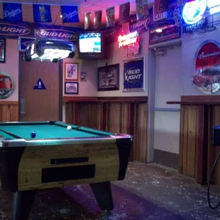 2 Pool tables in back of dining area.