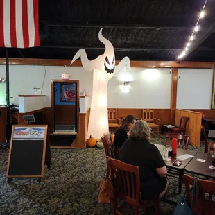 two people sitting at a table in a restaurant