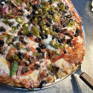 Pizza dough made in-house rolled thin and cooked to crispy in our stone oven. Soooo good!