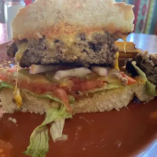 Burger on sourdough bun and all fresh veggies with cheese.