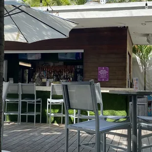 chairs and umbrellas on a deck