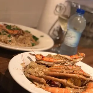 two plates of seafood and rice