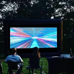 Blockbuster Party with 20-foot screen watching Ready Player One