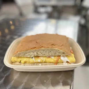 a sandwich in a styrofoam container