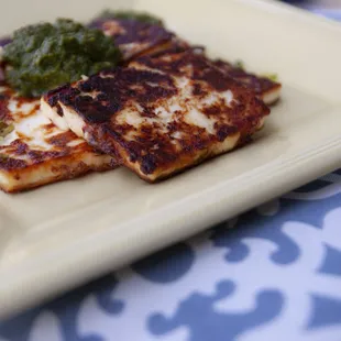 Paneer topped with cilantro chutney