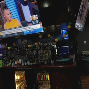 a bar with a television and a television screen