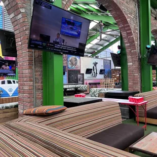 outdoor seating area with tvs