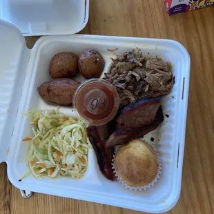 Brisket and pork, potatoes and coleslaw +cornbread
