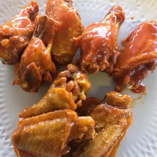 Buffalo style fried crispy and tossed in hot medium or mild sauce