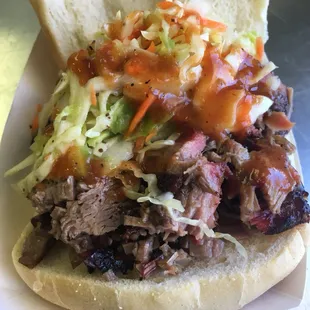 Brisket sandwich topped with slaw