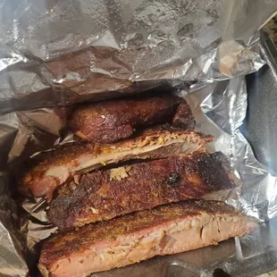 ribs in foil on a grill