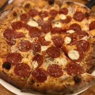 Old New York with pepperoni and caramelized onions