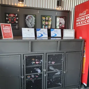 a counter with a vending machine in the background