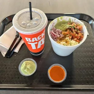 a drink and a bowl of food on a tray