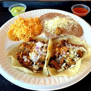 Two Chicken Tacos, Rice, Beans and Salsas from the Toppings Bar