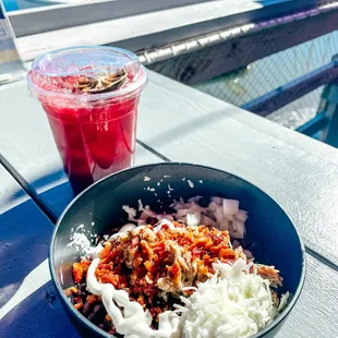 a bowl of food and a drink