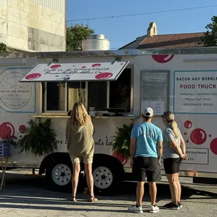 People lining up for Bacon &amp; Bubbles