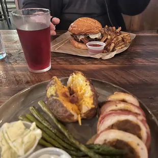 My boyfriend got the farmhouse burger, and I got the bacon wrapped stuffed chicken with loaded baked potato and asparagus