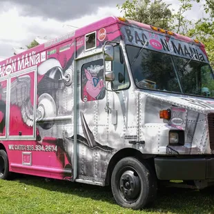 a pink and silver food truck