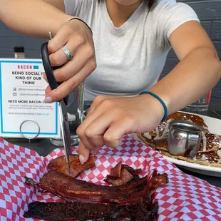 Here is my daughter carving up the bacon sampler. Wow! The Bloody Mary was also outstanding.