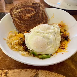 Country Potatoes with Green Peppers and Onions with bacon and an egg.