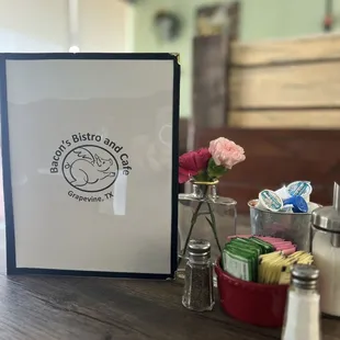 a picture of a table with salt and pepper shakers