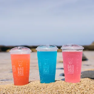 three cold drinks on the beach