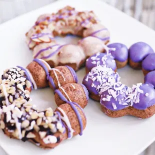 Ube Mochi Donuts flavors: Cafe Ube, Macadamia Nut, &amp; Ube Coconut!