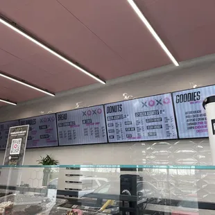 menus on the wall of a bakery