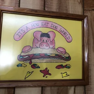 a pig eating a hot dog