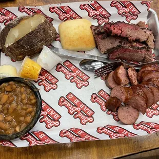 Sausage and Brisket plate with Baked Potato and Cowboy Beans