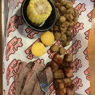 Build your own with Pork Belly Burnt Ends, sliced brisket, fried okra, and corn on the cob