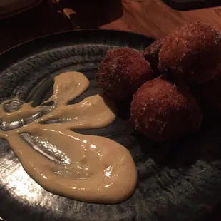 pear &amp; ricotta doughnuts with strawberry jam filling and orange crème anglaise