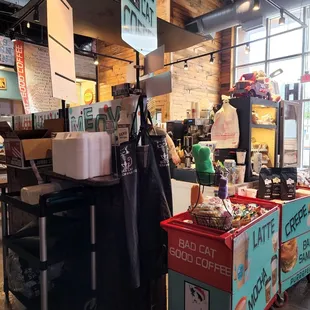 a coffee shop with a coffee cart