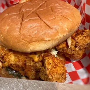 a fried chicken sandwich in a basket