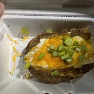 Baked "not" loaded potato. Stuffed with sour cream, thin layer of cheese, and a few chives-no bacon.